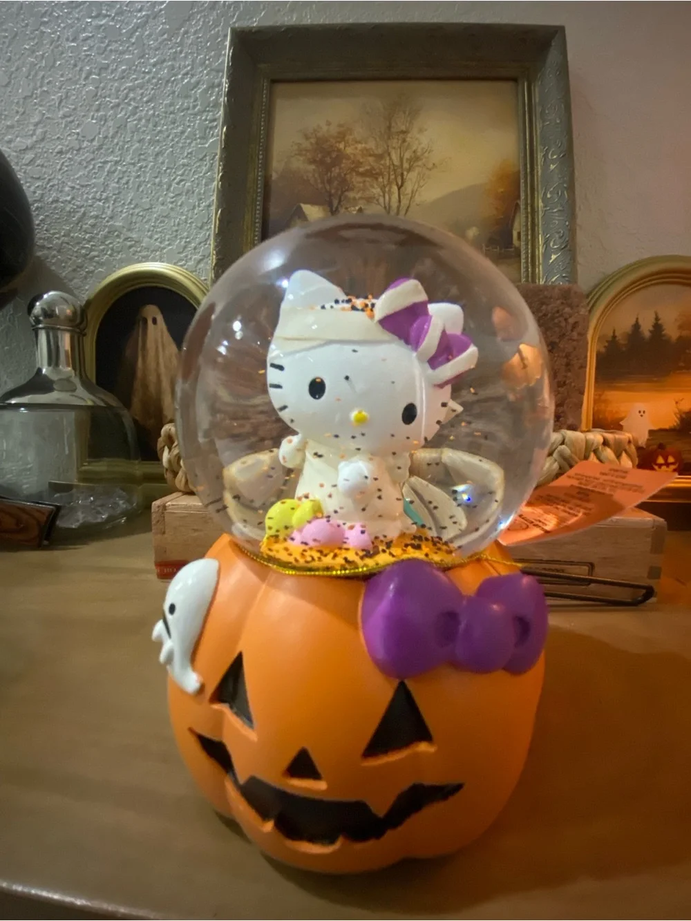Hello Kitty Orange Pumpkin musical Snow Globe with Purple Bow Accent